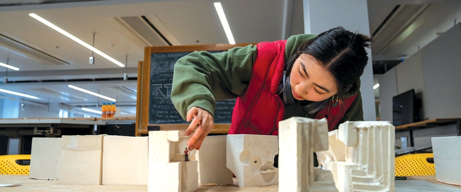 Student working on architectural model