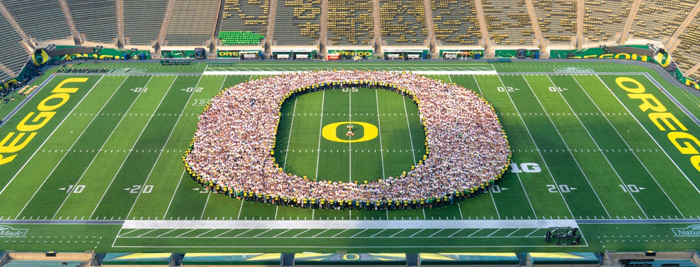 Class of 2029 group photo at Autzen Stadium
