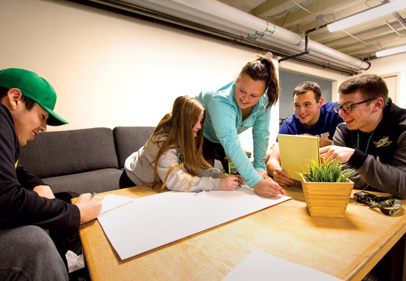 Photo of students working on projects in the innovation lab.