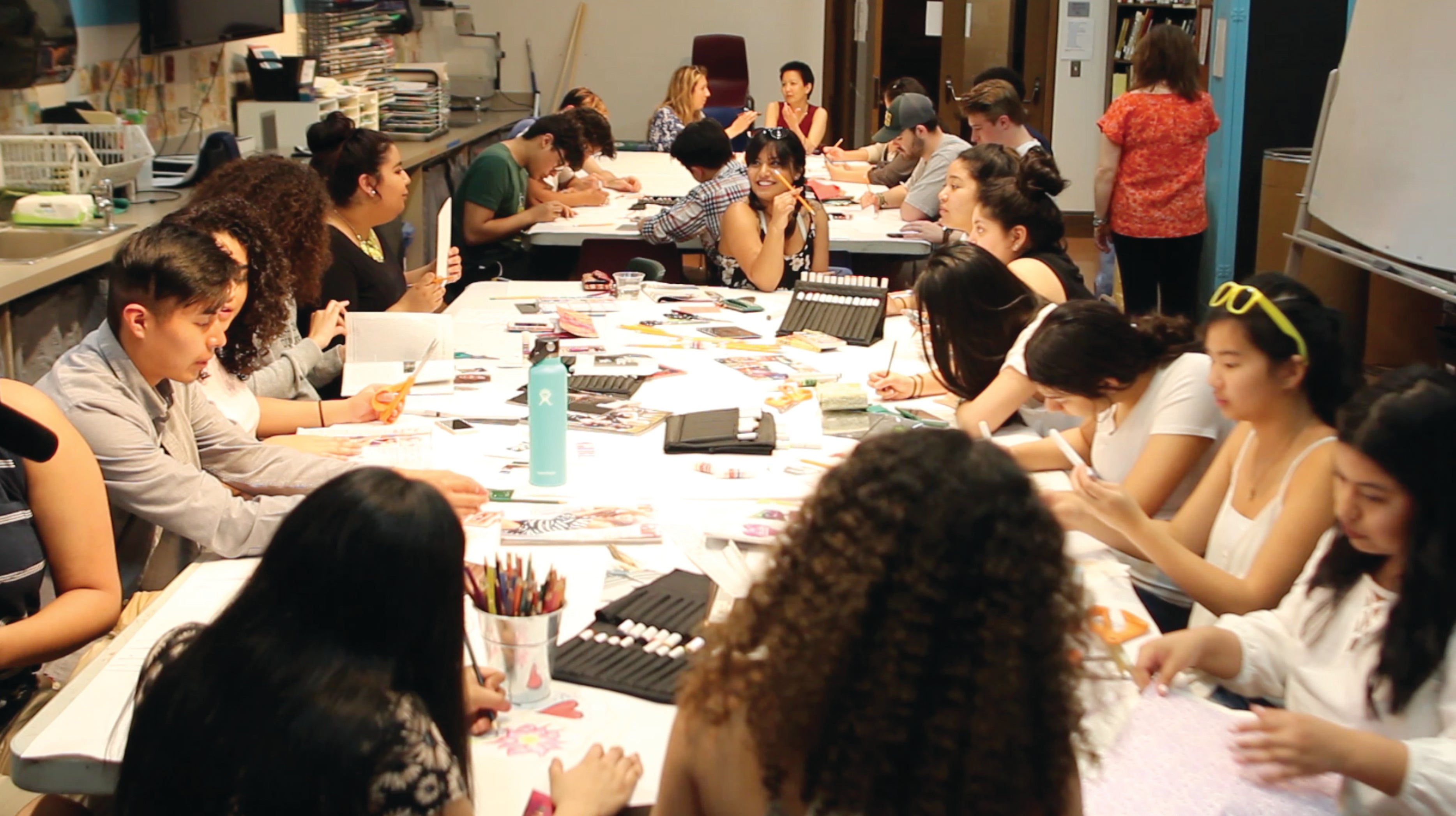 UO students around a table