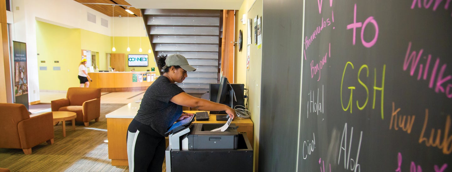 UO student at residence hall printer