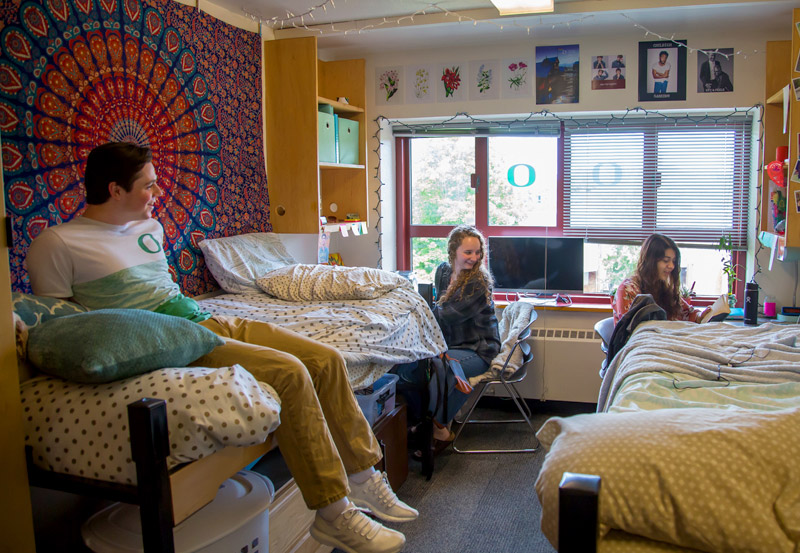 Photo of students living in Carson Hall reading.